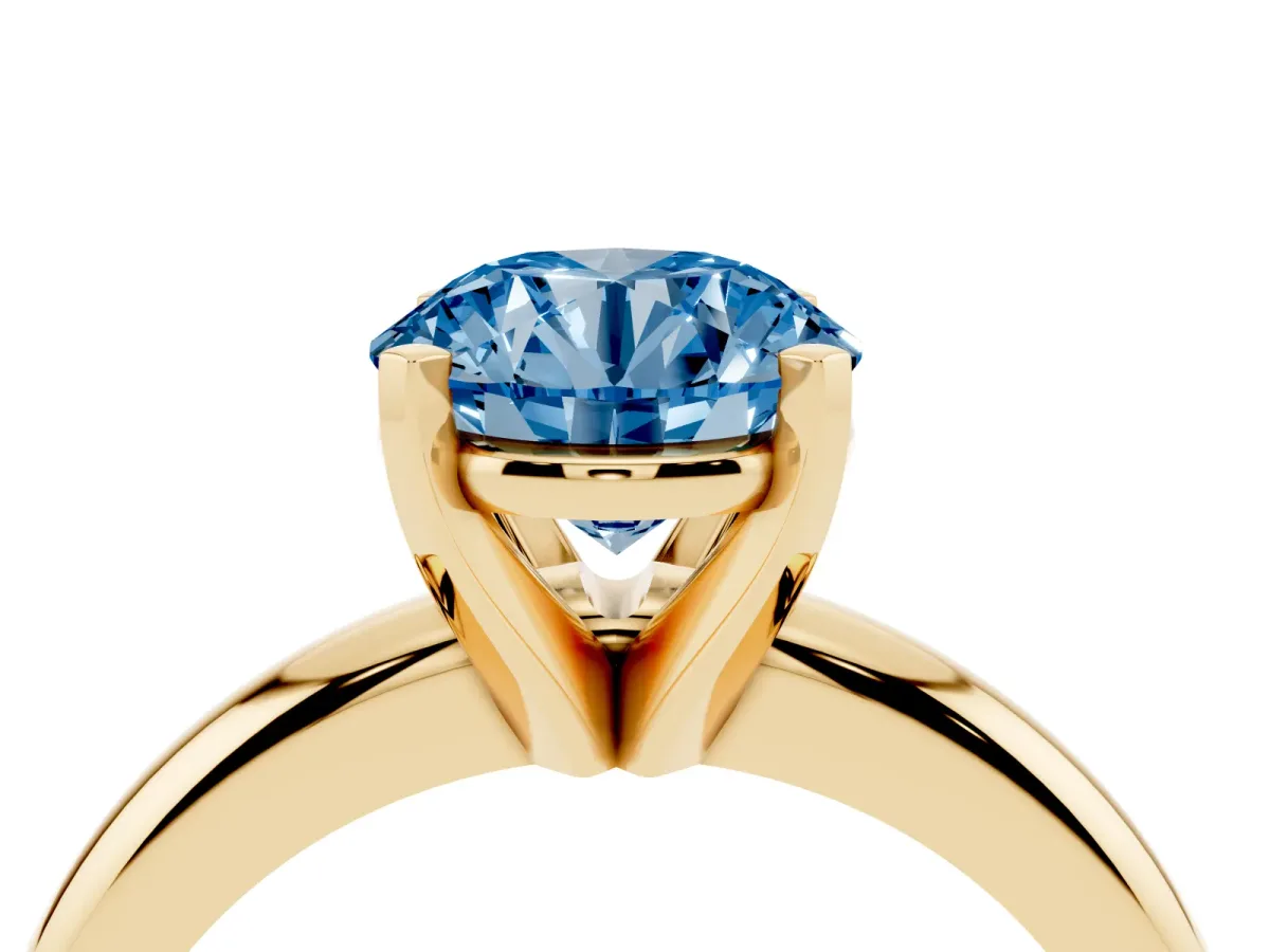 Fancy Blue Round Cut Diamond Solitaire Engagement Ring with Round Band and Four-Prong Setting Yellow gold