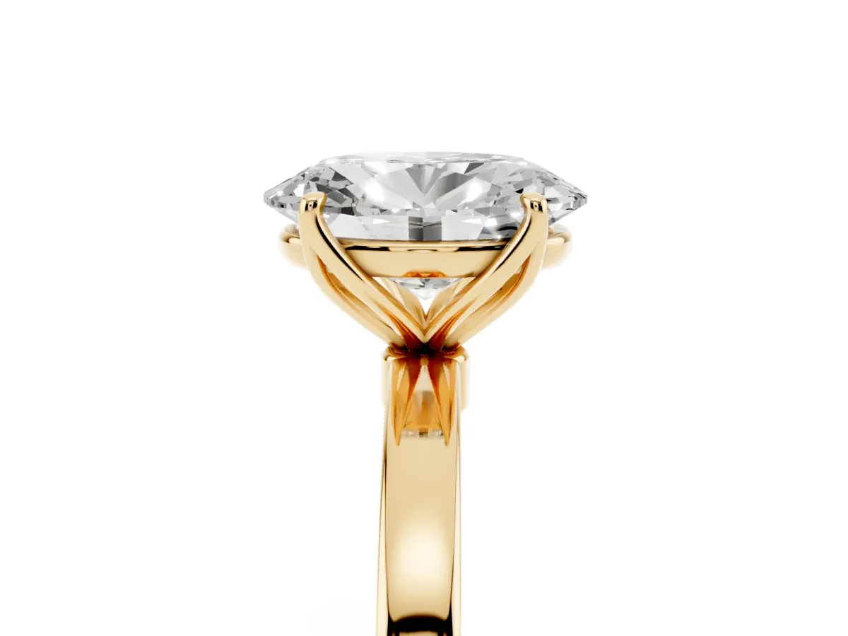 Oval Cut Diamond Solitaire Ring with Thin Band and Prong Setting Yellow gold