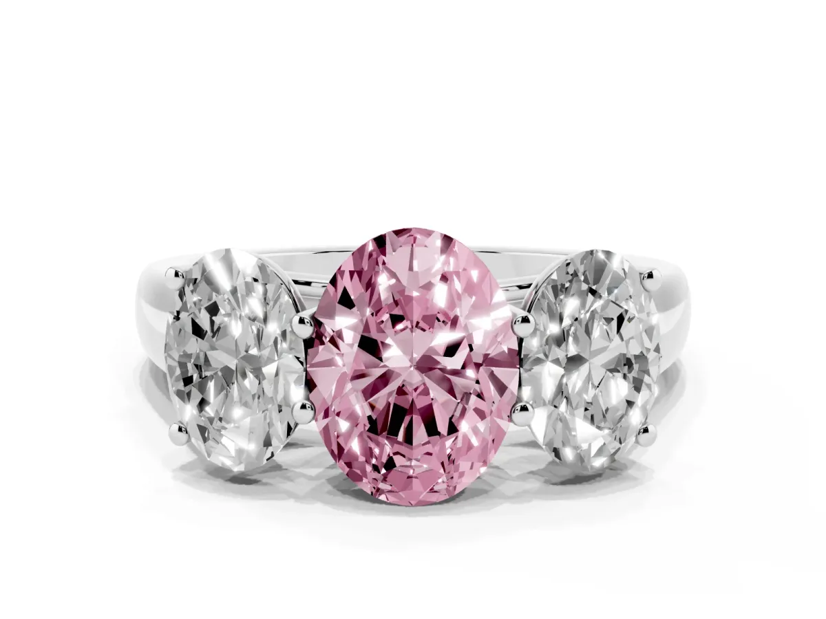 Fancy Pink Oval Cut Three-Stone Diamond Ring with Prong Setting on a Classic Band Platinum