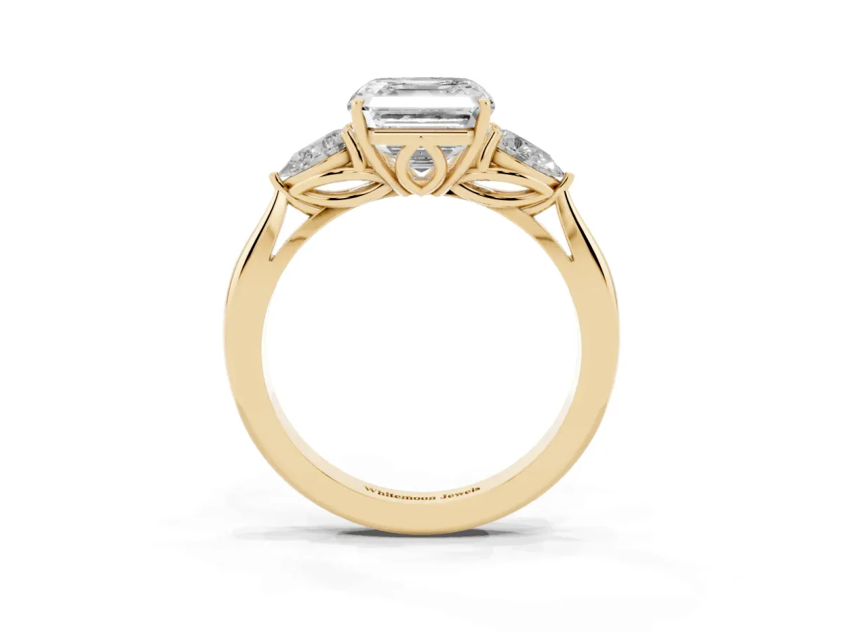 Three-Stone Asscher Cut Diamond Ring with Pear Side Stones in Four-Prong Setting Yellow gold