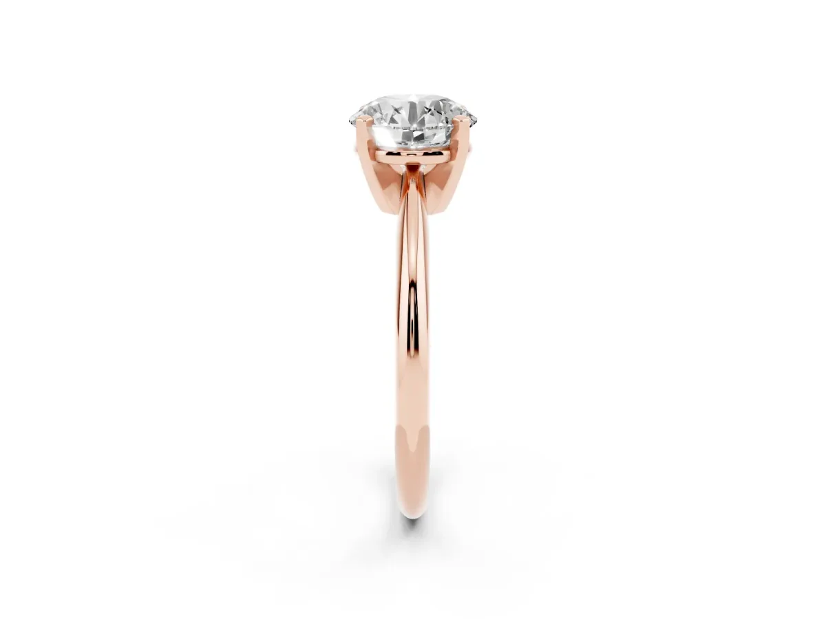 Round Cut Cut Solitaire Ring with Four-Prong Setting on a Classic Band Rose gold