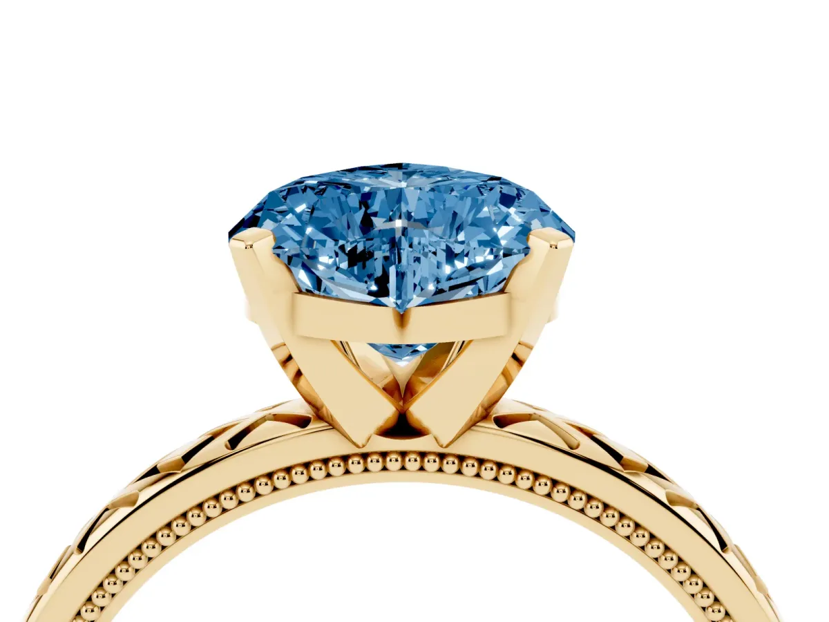 Fancy Blue Heart Cut Solitaire Diamond Ring with Milgrain and Black Enamel X Pattern Band Yellow gold
