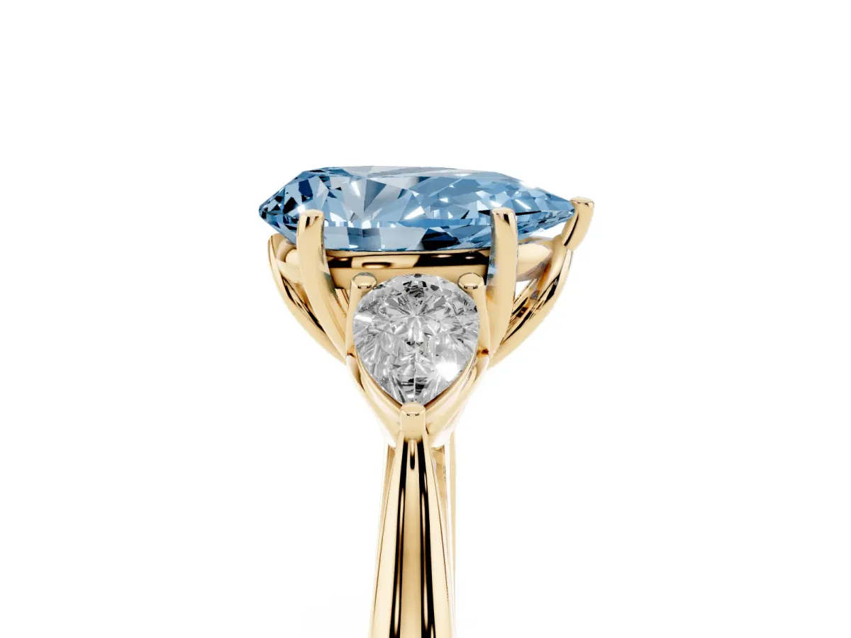 Fancy Blue Pear Cut Diamond Three-Stone Ring with Pear Side Stones and Prong Setting Yellow gold