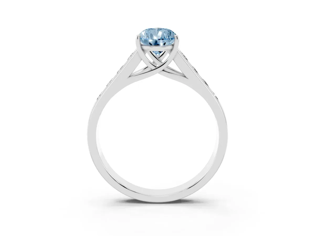 Fancy Blue Pear Cut Brilliant Channel-Set Solitaire Ring with Four-Prong Setting Silver