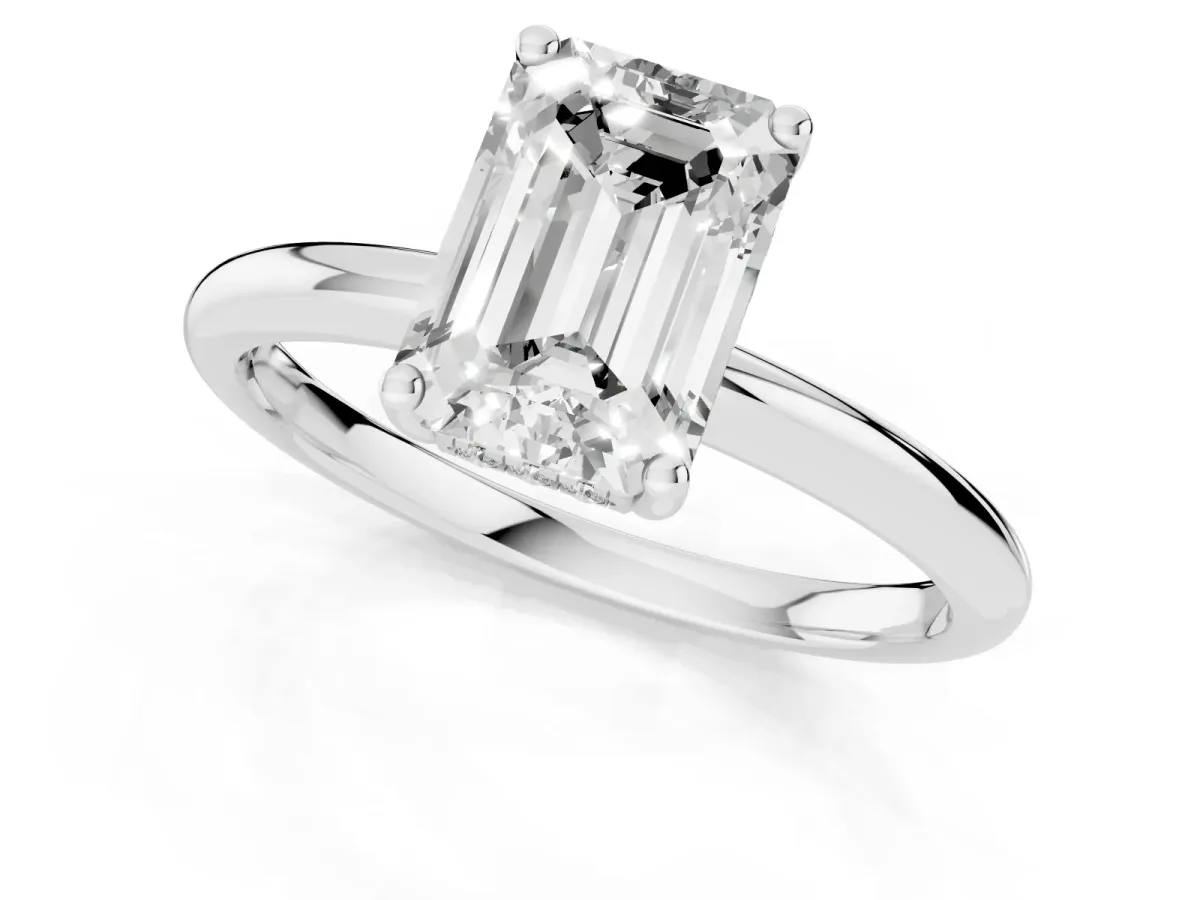 Emerald Cut Cut Solitaire Engagement Ring with Four-Prong Setting and Classic Band Silver