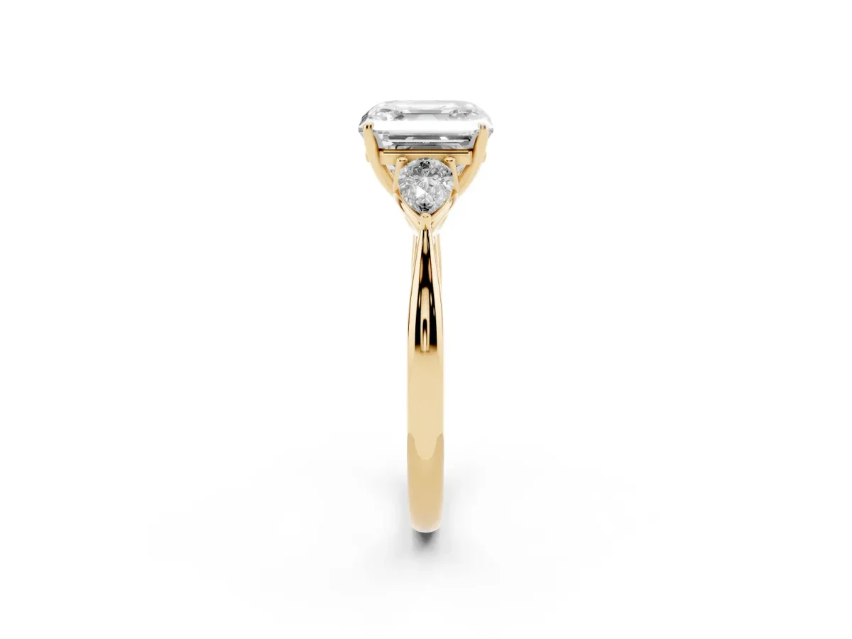 Asscher Cut Diamond Three-Stone Ring with Pear Side Stones and Prong Setting Yellow gold