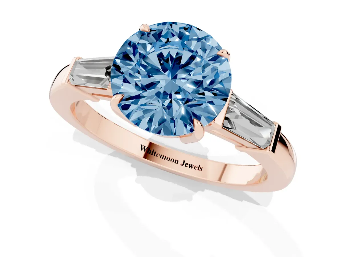 Fancy Blue Round Cut Diamond Three-Stone Ring with Tapered Baguette Side Stones and Prong Setting Rose gold