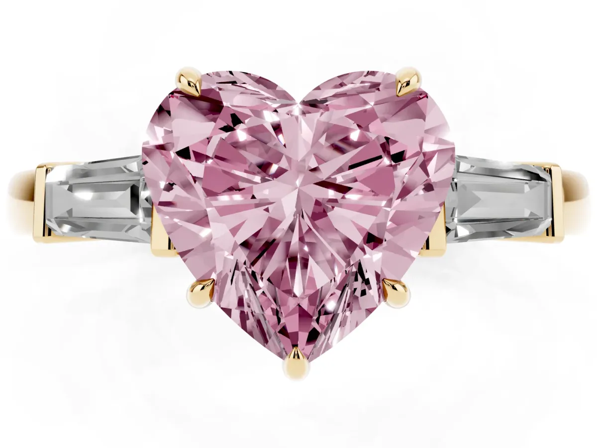 Fancy Pink Heart Cut Diamond Three-Stone Ring with Tapered Baguette Side Stones and Prong Setting Yellow gold