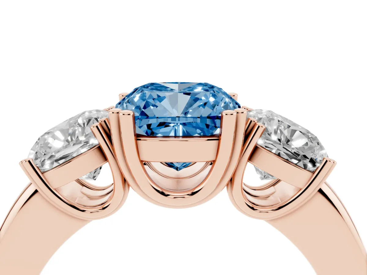 Fancy Blue Three-Stone Cushion Cut Cut Diamond Ring with Channel Set Band and Four-Prong Setting Rose gold