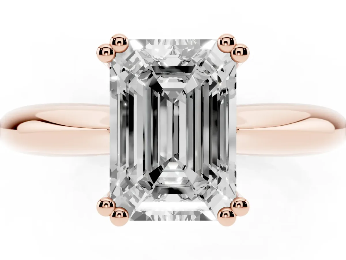 Emerald Cut Cut Solitaire Engagement Ring with Tapered Band and Four-Prong Setting Rose gold