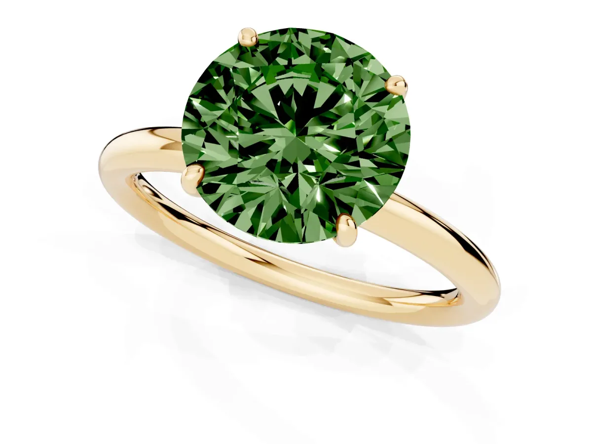 Fancy Green Round Cut Solitaire Diamond Ring with Four-Prong Setting on a Plain Band Yellow gold