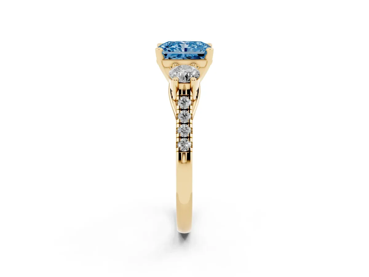 Fancy Blue Three-Stone Radiant Cut Diamond Pavé Band with Four-Prong Setting Yellow gold
