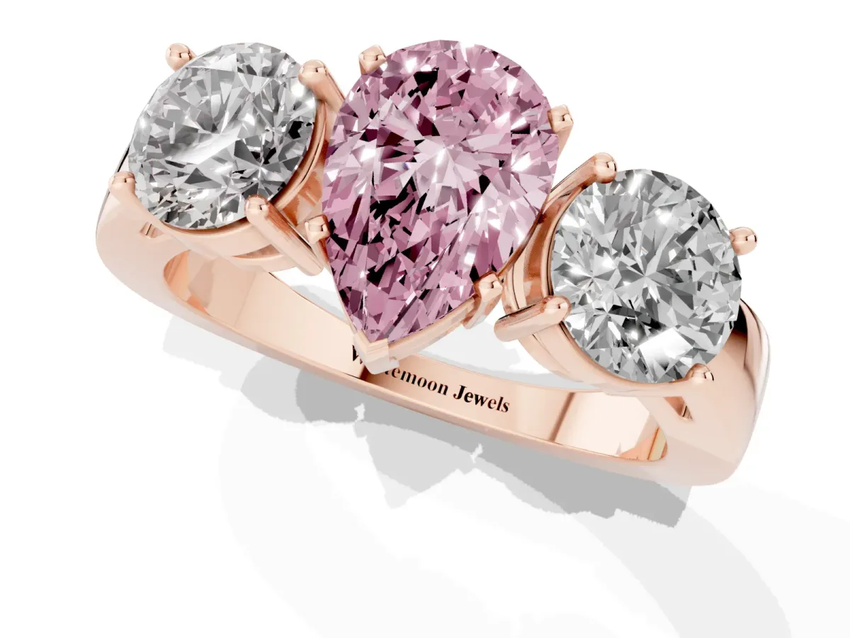 Fancy Pink Three-Stone Pear Cut Diamond Ring with Round Side Stones, Classic Band, and Four-Prong Setting Rose gold
