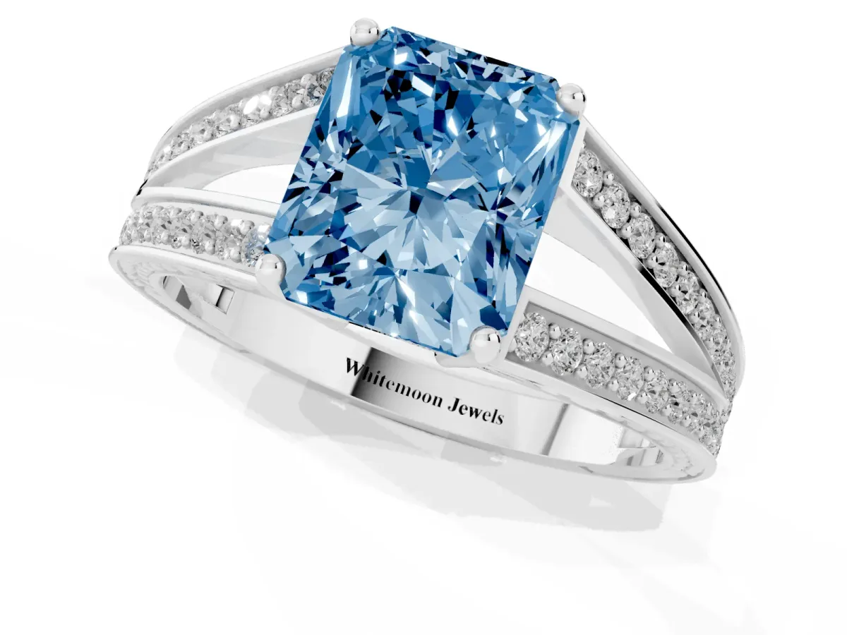 Fancy Blue Radiant Cut Diamond Split Shank Ring with Pavé Band and Four-Prong Setting White gold