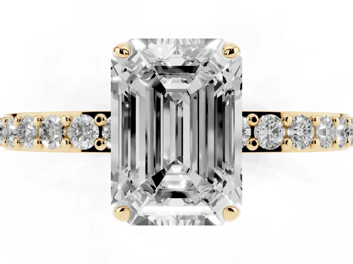 Emerald Cut Diamond Pavé Engagement Ring with Round Accents and Prong Setting Yellow gold