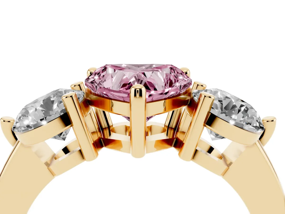 Fancy Pink Three-Stone Heart Cut Brilliant Cut Solitaire Ring with Prong Setting on a Classic Band Yellow gold