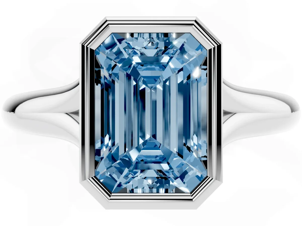 Fancy Blue Bezel Set Emerald Cut Solitaire Diamond Ring with Smooth Band Silver