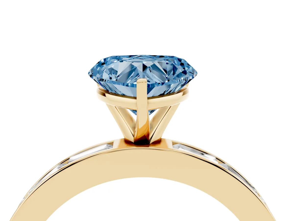 Fancy Blue Heart Cut Solitaire Diamond Ring with Channel-Set Baguette Band and Four-Prong Setting Yellow gold