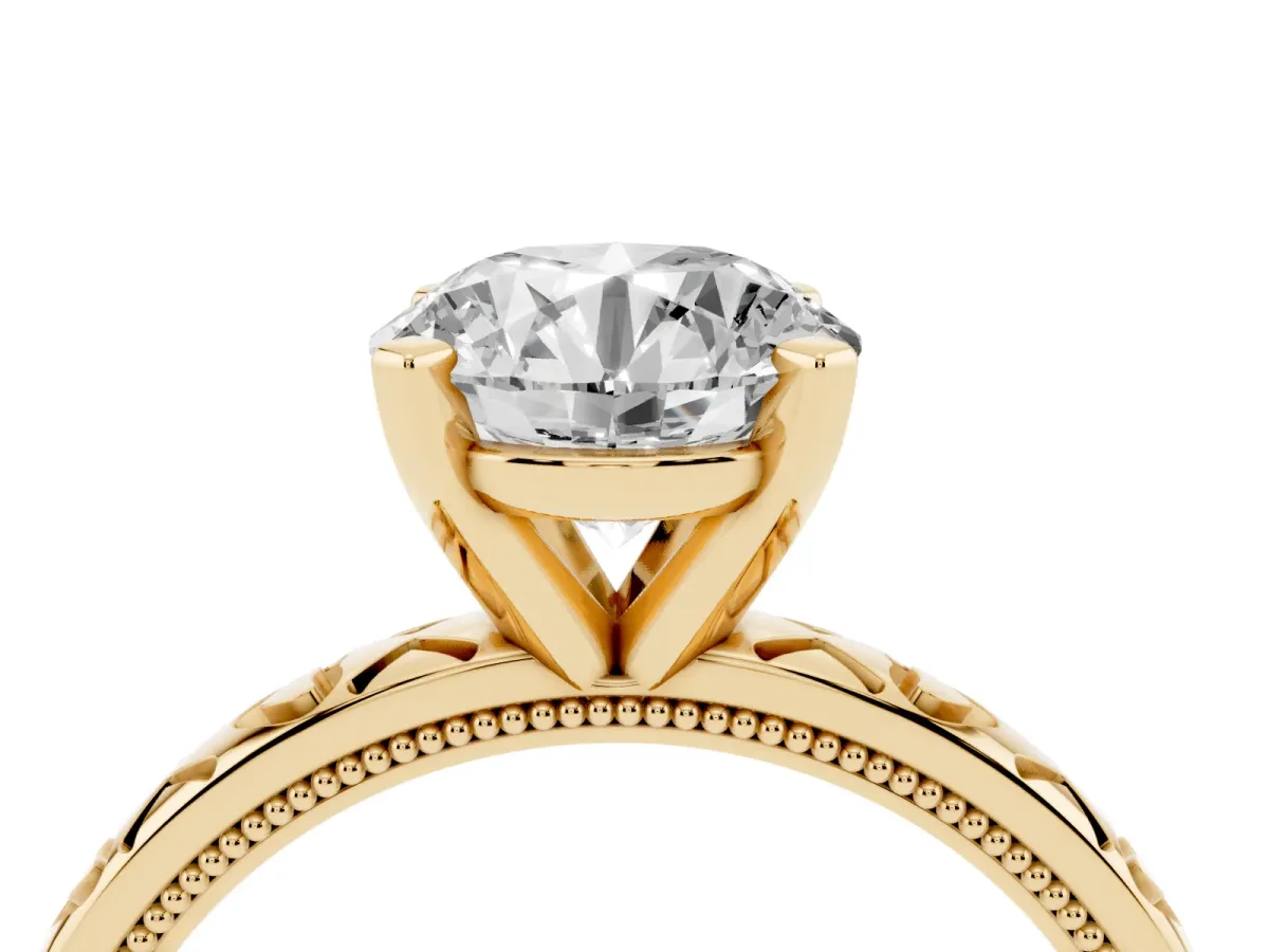 Round Cut Solitaire Diamond Engagement Ring with XO Engraved Band and Four-Prong Setting Yellow gold