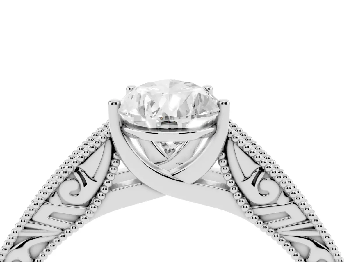 Pear Cut Diamond Solitaire Ring with Engraved Band and Four-Prong Setting Silver