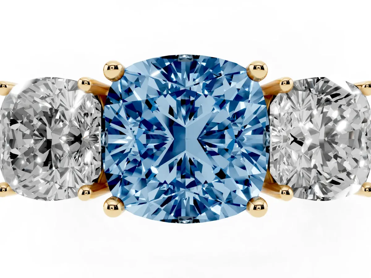 Fancy Blue Three-Stone Cushion Cut Cut Diamond Engagement Ring with Prong Setting on a White Gold Band Yellow gold