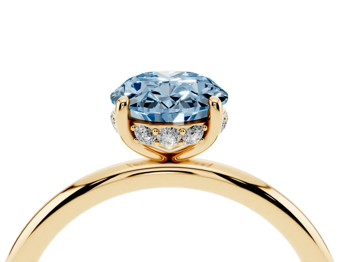 Fancy Blue Oval Cut Solitaire Diamond Ring with a Classic Band and Four-Prong Setting Yellow gold