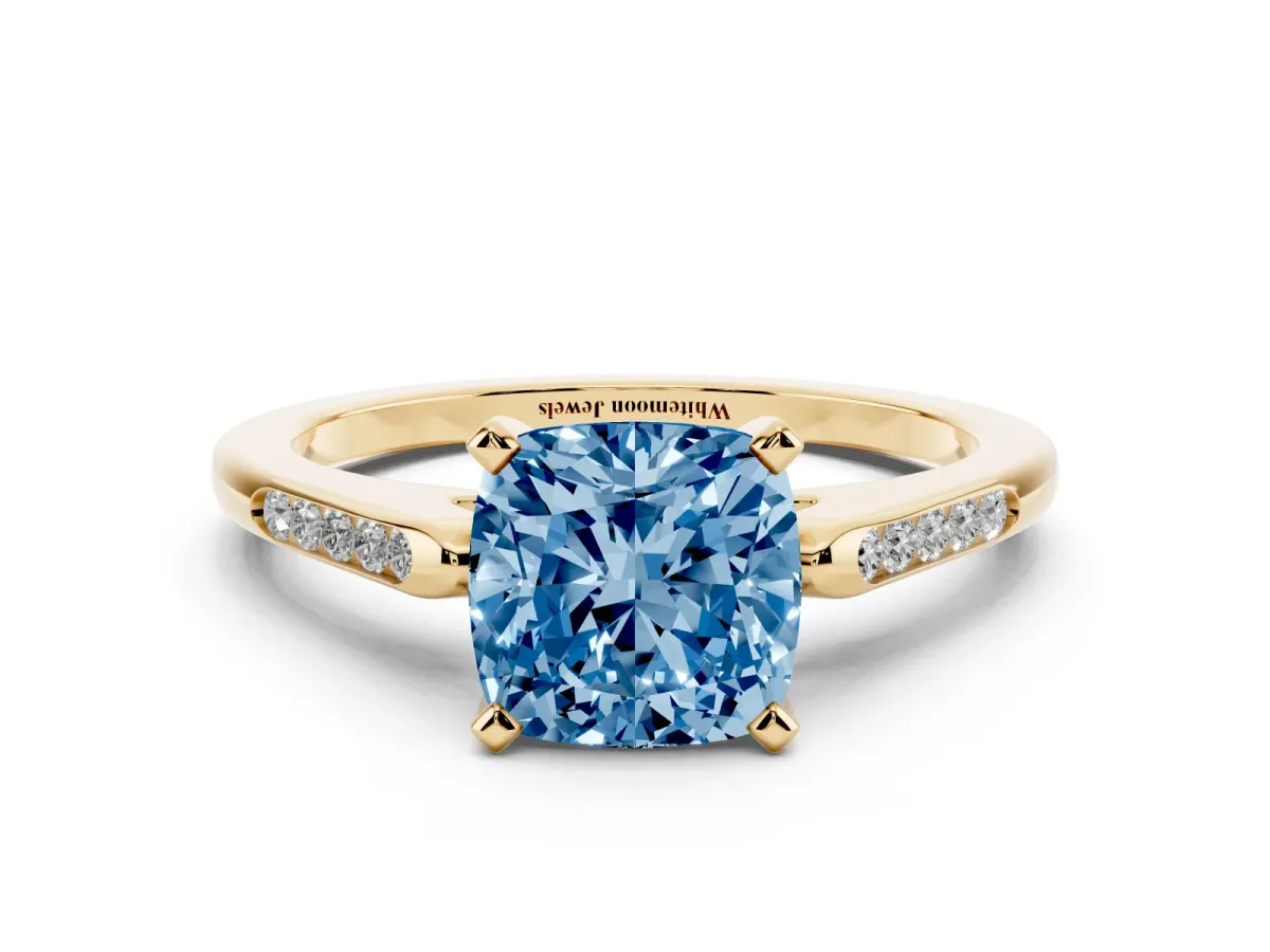 Fancy Blue Cushion Cut Diamond Solitaire Ring with Channel Set Round Band and Prong Setting Yellow gold