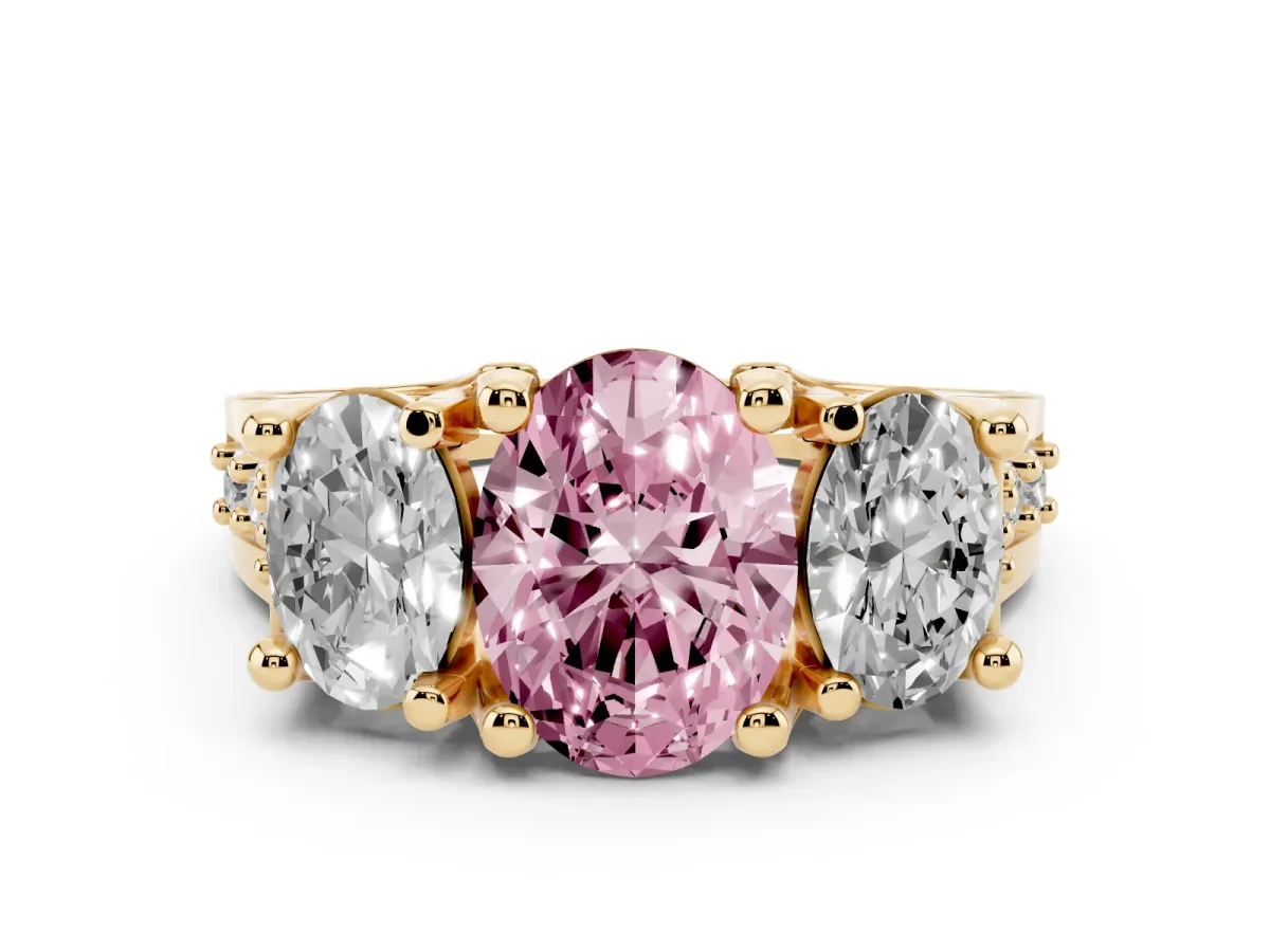 Fancy Pink Oval Cut Diamond Three-Stone Ring with Channel Set Band and Four-Prong Setting Yellow gold