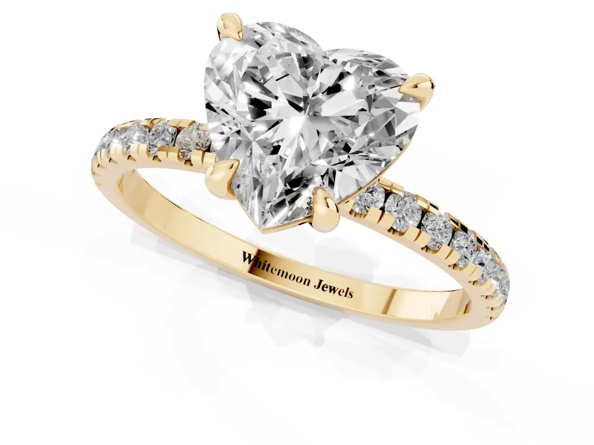 Heart Cut Diamond Brilliant Solitaire Ring with Pavé Band and Four-Prong Setting Yellow gold