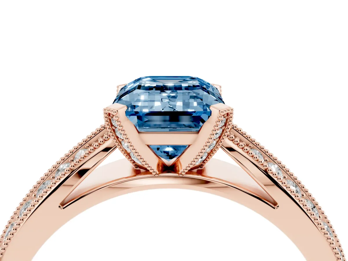Fancy Blue Emerald Cut Diamond Solitaire Ring with Milgrain Round Pavé Band and Prong Setting Rose gold