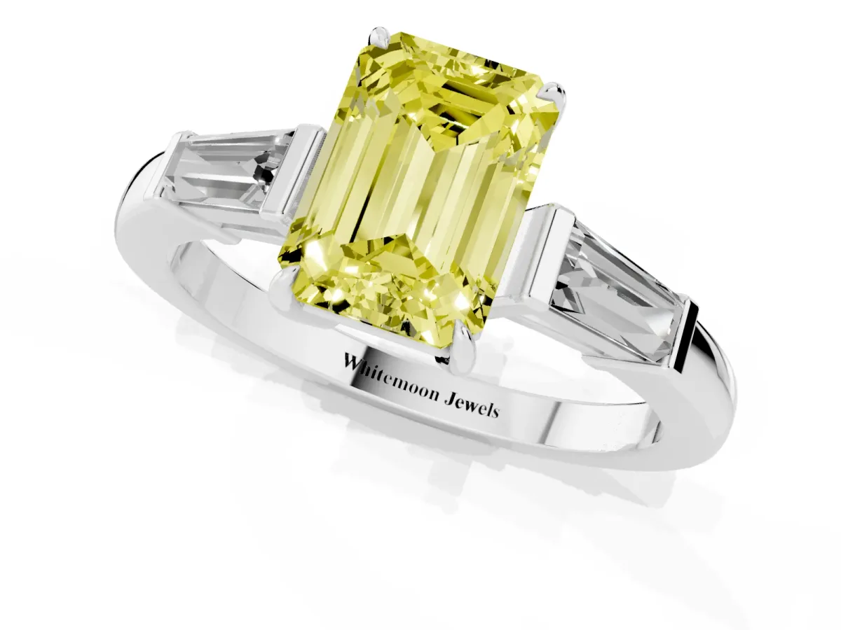 Fancy Yellow Emerald Cut Diamond Three-Stone Ring with Tapered Baguette Side Stones and Prong Setting White gold
