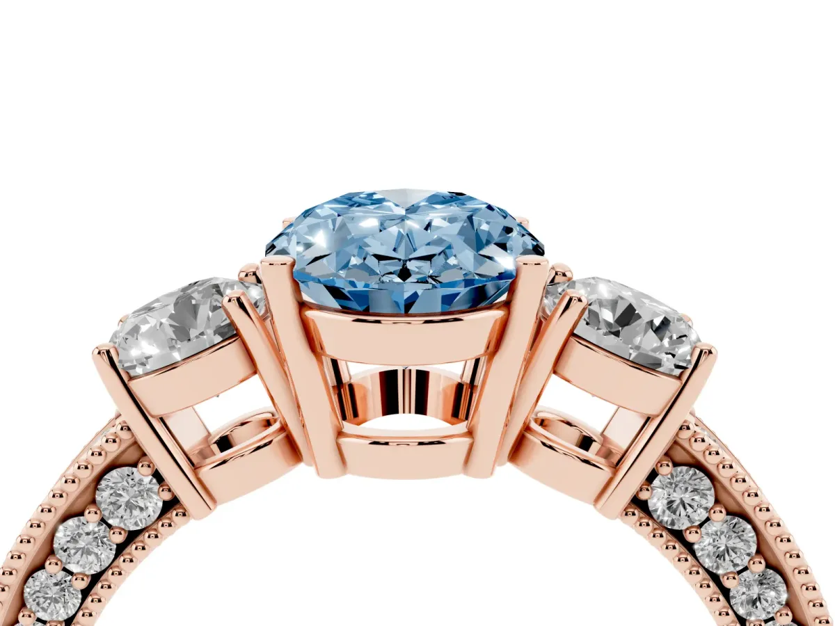 Fancy Blue Oval Cut Three-Stone Diamond Ring with Pavé Band and Four-Prong Setting Rose gold