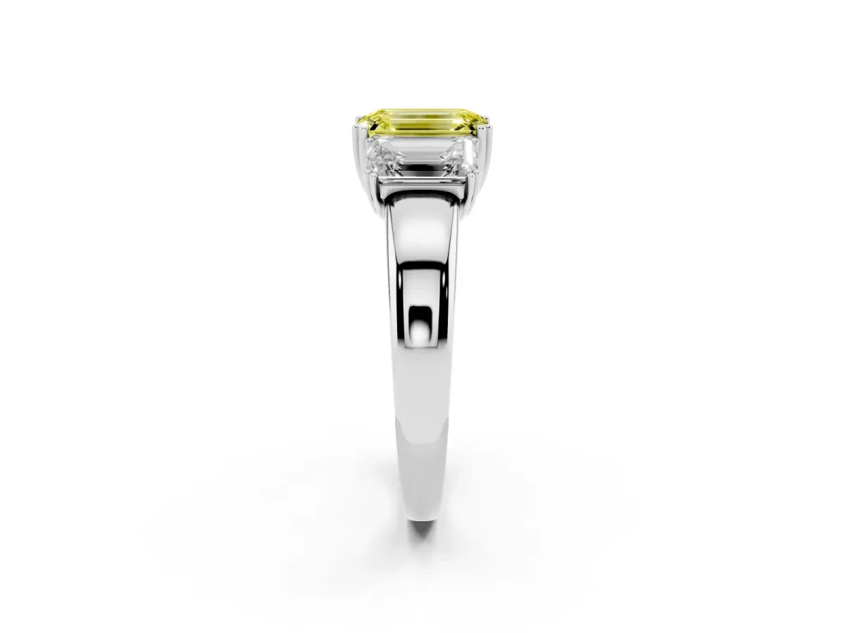 Fancy Yellow Three-Stone Emerald Cut Cut Diamond Ring with Channel Set Band and Four-Prong Setting White gold