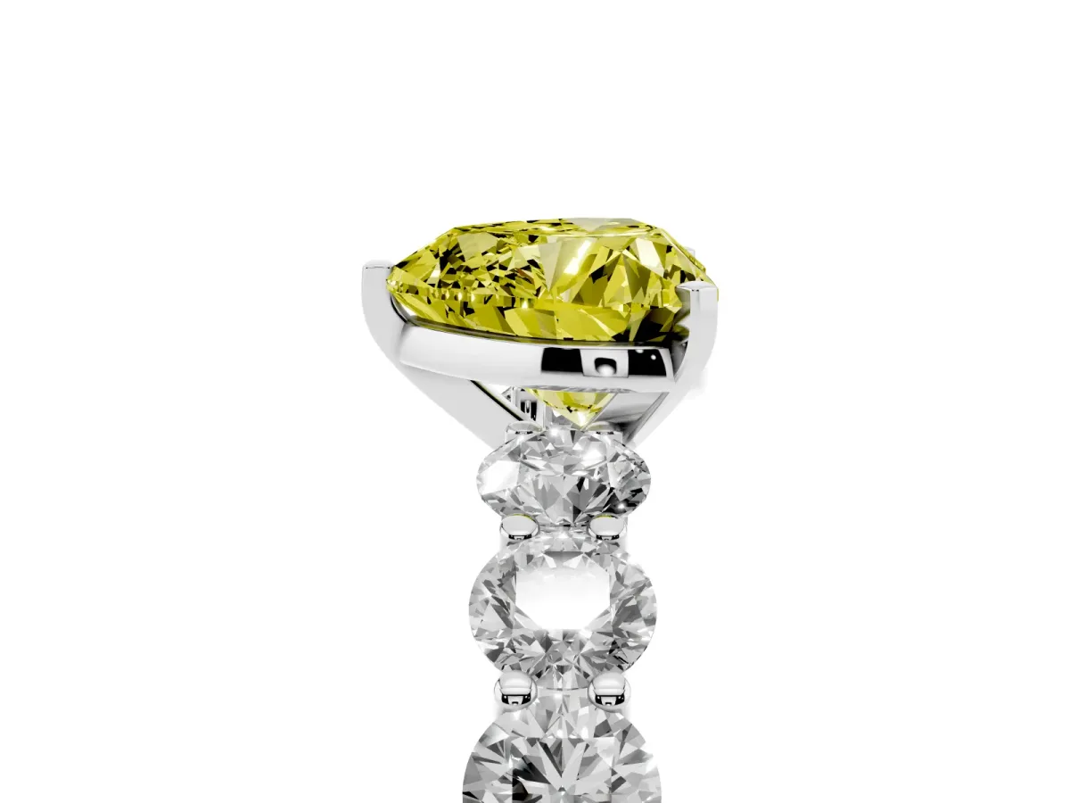 Fancy Yellow Heart Cut Diamond Prong Setting with Side Stones on a Pave Band Silver