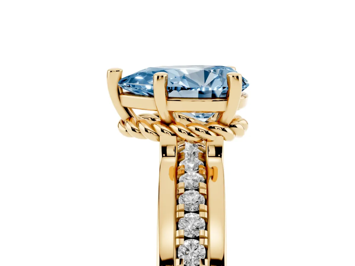 Fancy Blue Pear Cut Solitaire Diamond Ring with Channel Set Band and Six-Prong Setting Yellow gold