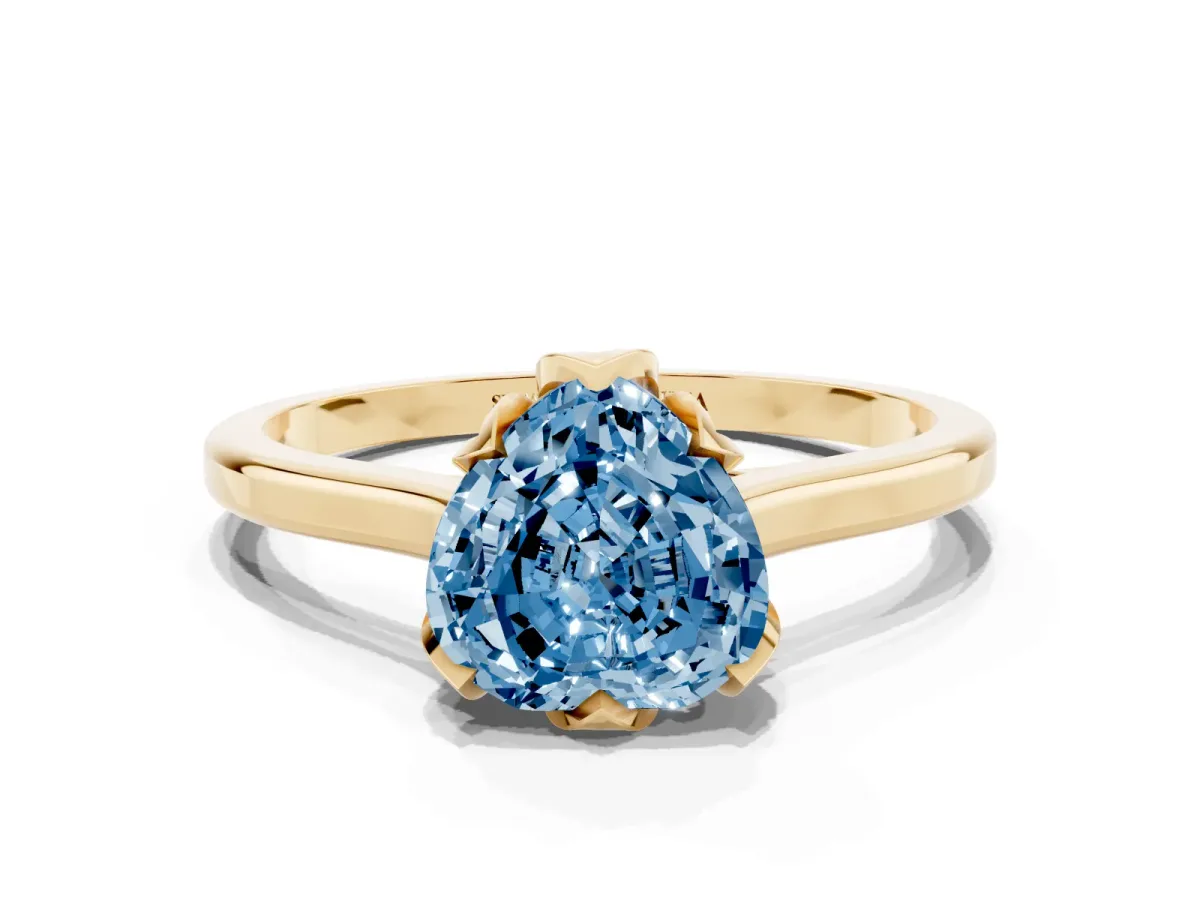 Fancy Blue Heart Cut Diamond Solitaire Ring with Flower Prong Setting and Classic Band Yellow gold