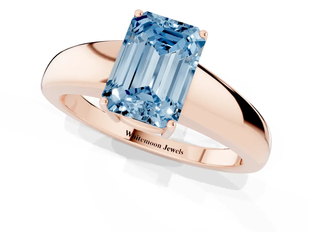 Fancy Blue Emerald Cut Solitaire Diamond Ring with Tapered Band and Four-Prong Setting Rose gold
