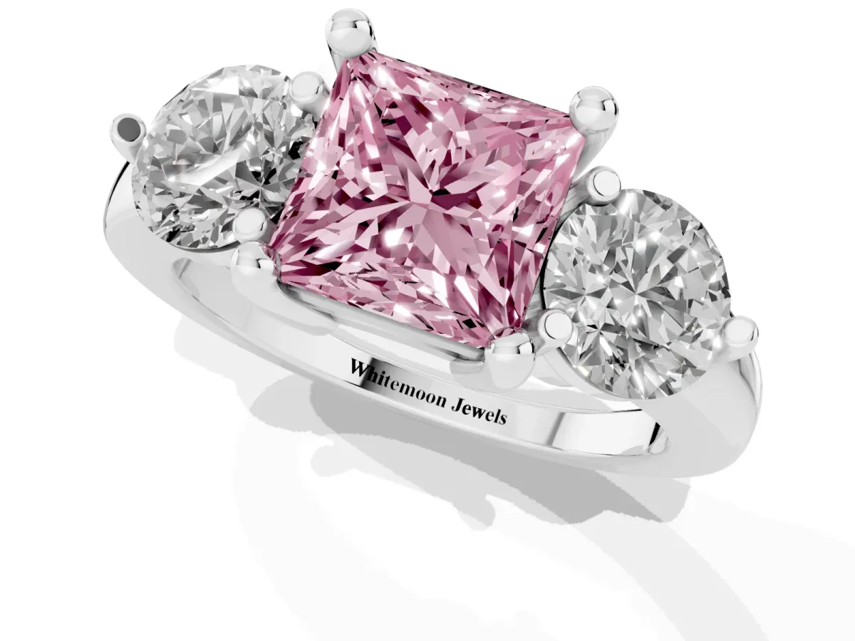 Fancy Pink Three-Stone Princess Cut Brilliant Cut Solitaire Ring with Prong Setting on a Classic Band Silver