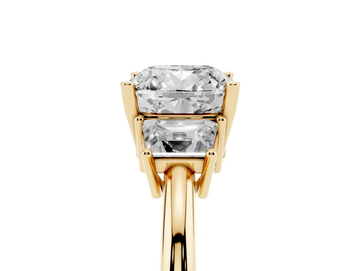 Cushion Cut Diamond Three-Stone Ring with Trapezoid Side Stones and Prong Setting Yellow gold