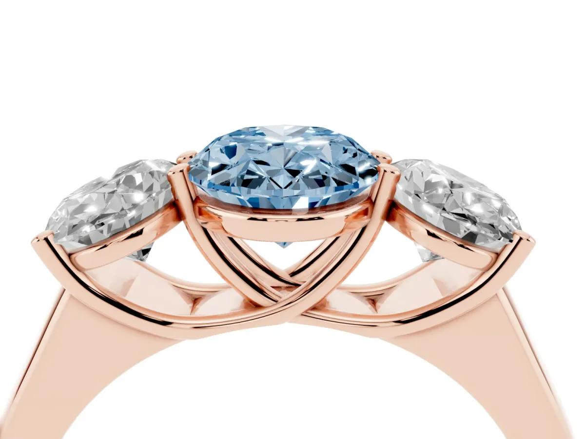 Fancy Blue Oval Cut Three-Stone Diamond Ring with Prong Setting on a Classic Band Rose gold
