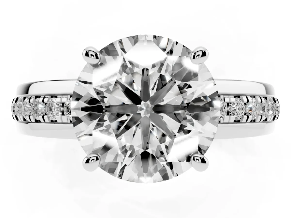 Round Cut Solitaire Diamond Ring with Channel Set Band and Six-Prong Setting Silver