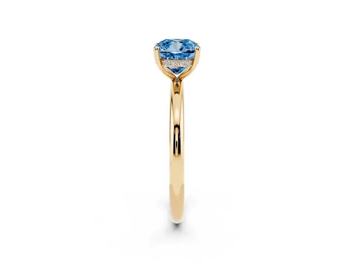 Fancy Blue Cushion Cut Diamond Solitaire Ring with Thin Band and Four-Prong Setting Yellow gold