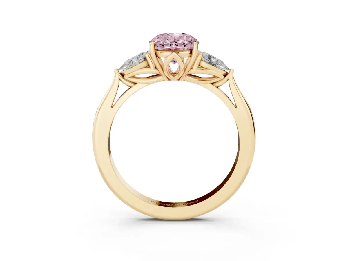 Fancy Pink Three-Stone Oval Cut Diamond Ring with Pear Side Stones in Four-Prong Setting Yellow gold