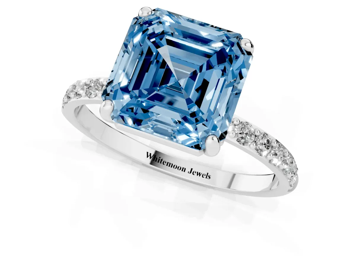 Fancy Blue Asscher Cut Diamond Solitaire Ring with Round Pavé Band and Prong Setting Silver
