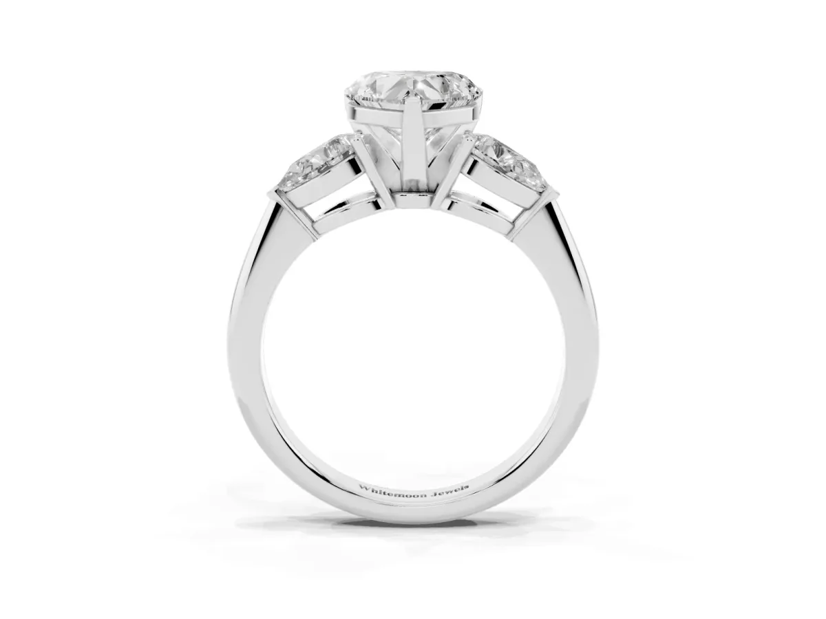 Three-Stone Heart Cut Diamond Ring with Pear Side Stones and Four-Prong Setting Platinum