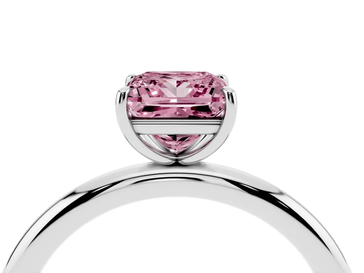 Fancy Pink Princess Cut Solitaire Diamond Ring with Four-Prong Setting on a Plain Band Platinum