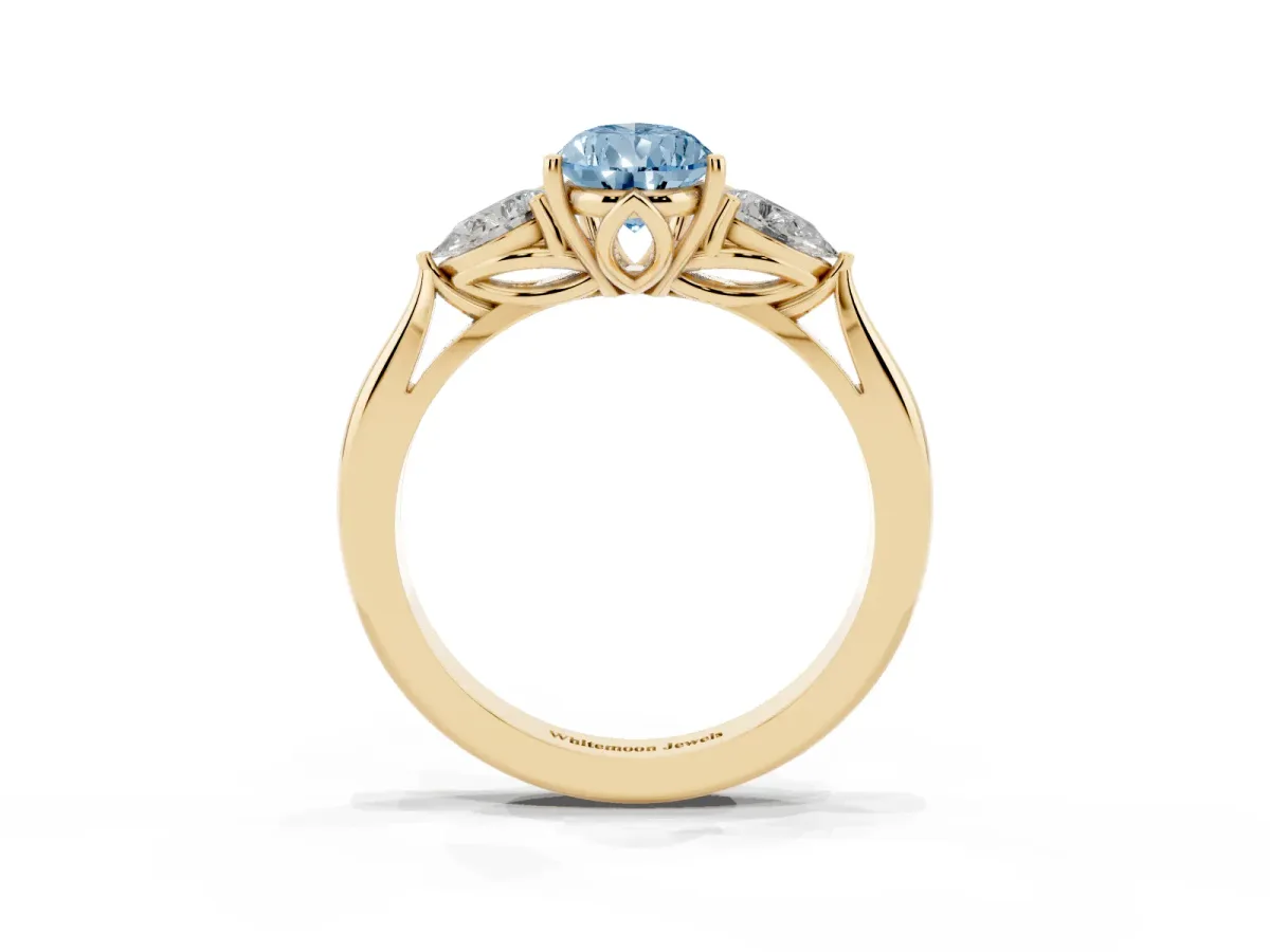 Fancy Blue Pear Cut Diamond Three-Stone Ring with Pear Side Stones and Prong Setting Yellow gold