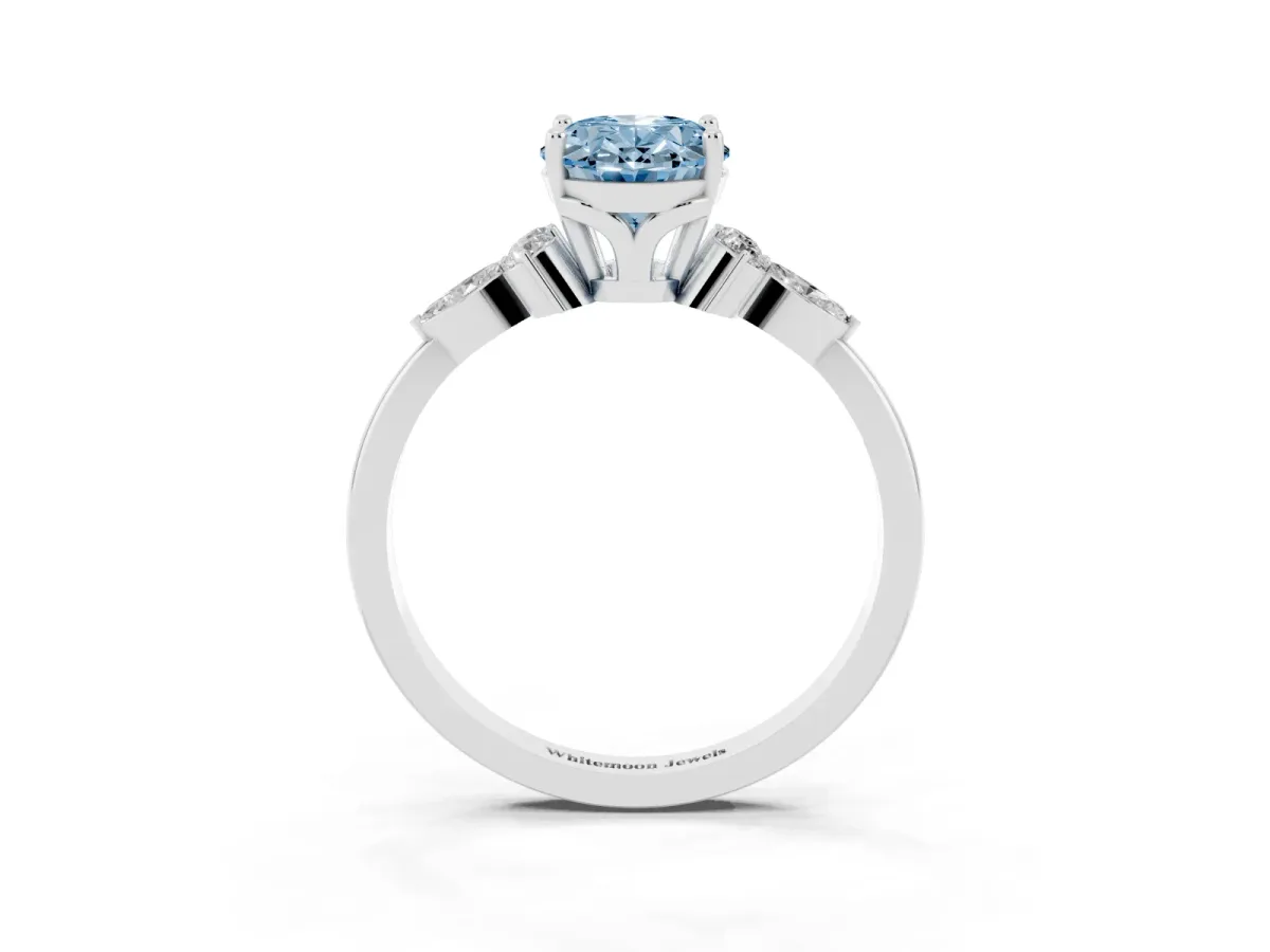 Fancy Blue Oval Cut Brilliant Diamond Solitaire Ring with Pear Side Stones and Four-Prong Setting Silver