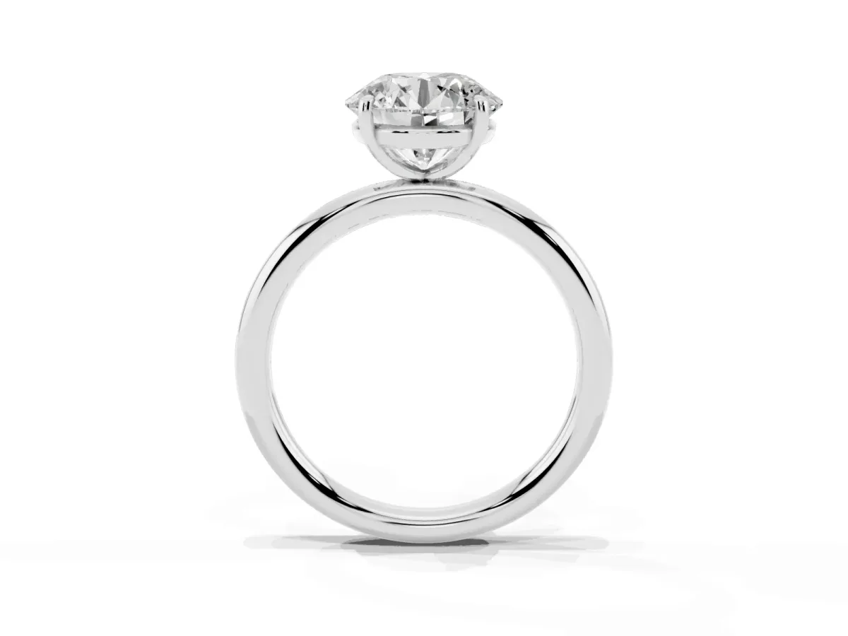 Round Cut Solitaire Diamond Ring with Four-Prong Setting on a Plain Band Platinum