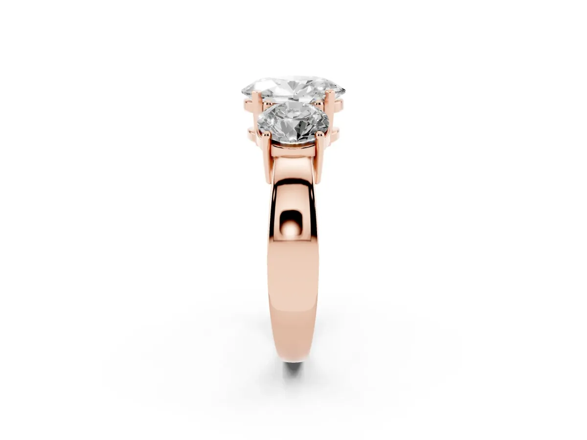 Three-Stone Oval Cut Diamond Ring with Round Side Stones, Classic Band, and Four-Prong Setting Rose gold